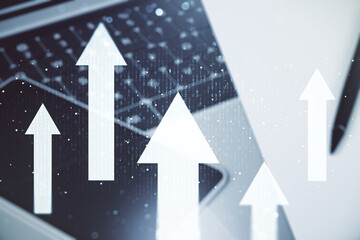 Double exposure of creative abstract upward arrows hologram on laptop background. Ambition and challenge concept