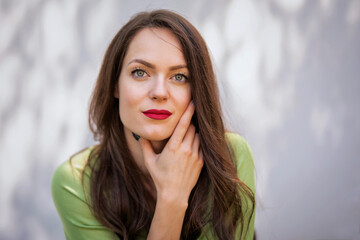 Portrait of young woman with beautiful green eyes and brunette hair