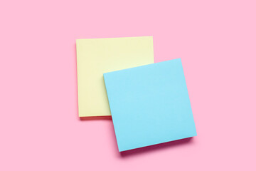 Sticky notes on pale pink background