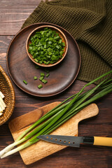 Fresh green onion on wooden background