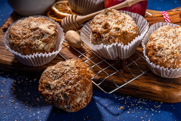 Apple pie crumble streusel muffins, Sweet autumn baking pastry with red apple slices, cinnamon and spices and crumble toppings