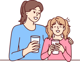 Fototapeta premium Mom and daughter drink natural milk to get useful vitamins and lactose or calcium from eco product