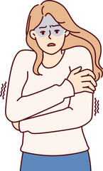 Fototapeta premium Freezing woman hugging shoulders trying to keep warm and feeling chills after contracting flu