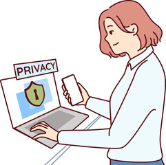 Fototapeta na wymiar Businesswoman takes care of cyber security standing next to laptop with privacy inscription