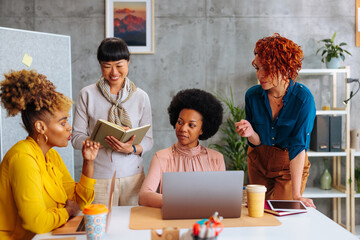 Obraz premium Diverse female collective having boardroom meeting