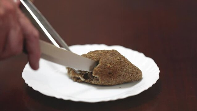 Serving traditional Syrian Lebanese kibbeh stuffed and hot in video 4K