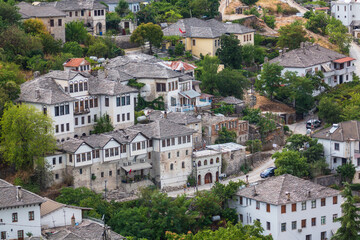 Fototapeta na wymiar Cityscape of Gjirokaster old town, Albania. Christian church and old ottoman houses in Gjirokaster, Albania close-up