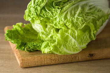 Chinese cabbage or Napa cabbage on wooden cutting board