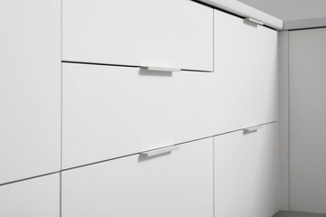 White drawers in modern kitchen, closeup
