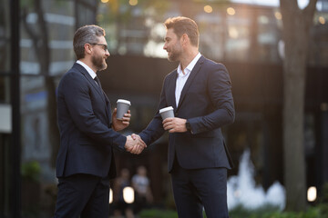 happy two business partners dealing negotiation. two business partners dealing negotiation outdoor.