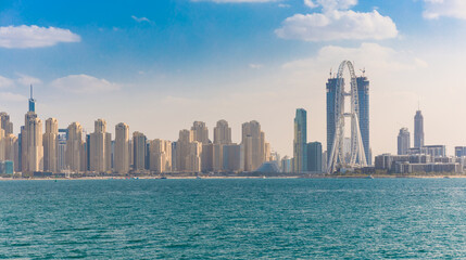 Fototapeta na wymiar View of Dubai with skyscrapers. Sunny summer day in UAE