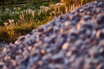 A heap of fine granite stones in the warm sunlight