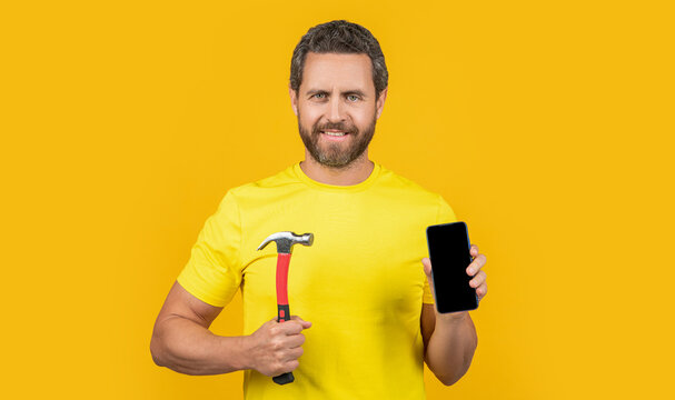 happy man hack the phone isolated on yellow. man hack the phone on background.
