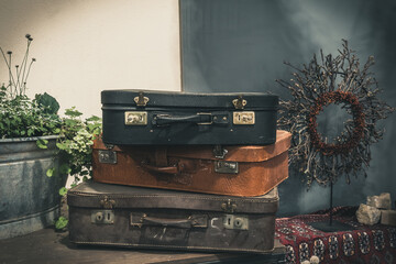 Two old classic travel leather suitcases. Travel luggage concept. Decoration in vintage style.