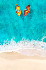 Obraz premium Aerial View of Sandy Tropical Beach and Ocean with Yellow and Red Boats Floating on Turquoise Water. AI generative. Summer Poster Background.