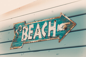 Rusty old vintage style beach tin sign