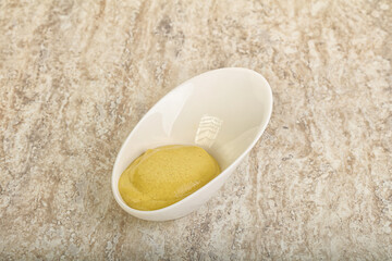 Organic mustard sauce in the bowl