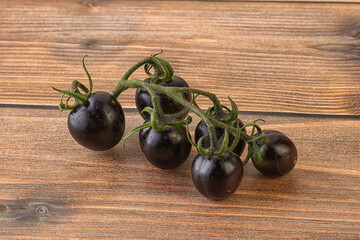 Ripe tasty black cherry tomato