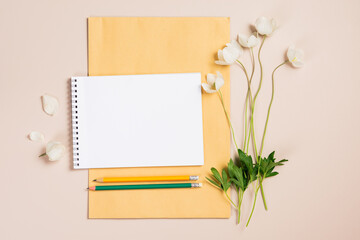 Anemone flowers, notebook blank mockup,  copy space.