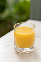 Fresh orange juice served in a marble table