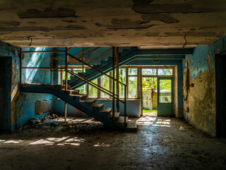 Old abandoned forgotten building, inside view. Former children's camp in Russia, Moscow region. day light