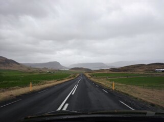 Lonely Road in Iceland with clouds