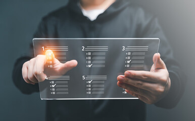 Assessment, Questionnaire, Evaluation, Survey Concept. business man Take an assessment online survey online exam Choosing the right answer on exam. Answer the test question checkbox feedback statistic