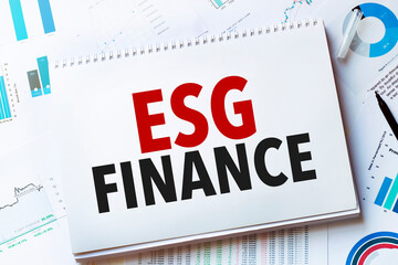 Notebook with Tools and Notes with text esg finance
