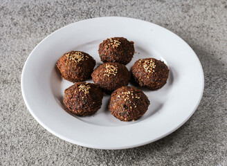 falafel plate with sesame seeds served in dish isolated on background top view of Arabic fast food