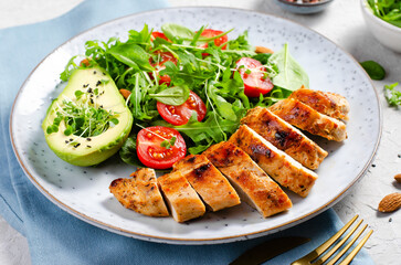 Grilled Chicken Fillet with Fresh Salad, Cherry Tomatoes and Avocado, Healthy food, Keto, Paleo Diet Menu