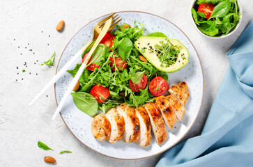 Grilled Chicken Fillet with Fresh Salad, Cherry Tomatoes and Avocado, Healthy food, Keto, Paleo Diet Menu