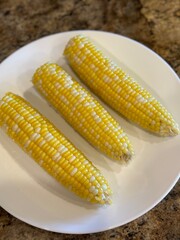 Shucked charcoal grilled corn on the cob