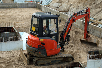 excavator on construction site - 607560332