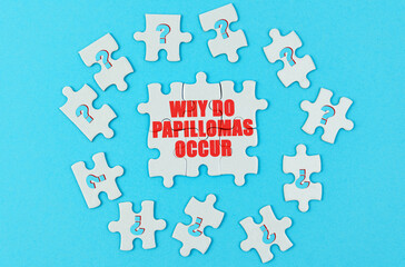 On a blue surface are puzzles with a question mark, in the center with the inscription - why do papillomas occur