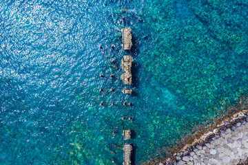 Aerial Capture of Collapsed Pier in Crystal Clear Maui Waters