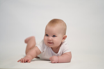 Smiling newborn baby. the photo was taken against a light background