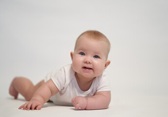 Fototapeta premium Smiling Newborn Baby on White Background