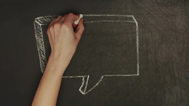 Hand drawn drawing of blank three-dimensional speech bubble sign. Speech notation drawn by the hand with chalk on a blackboard in timelapse