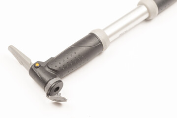 Aluminum bicycle pump isolated above white background with copy space