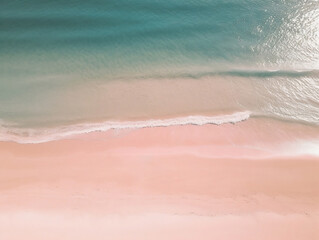 Aerial view from the top of teal ocean beach and pink sand 