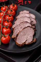 Delicious beef steak with salt, spices and herbs on a ceramic plate