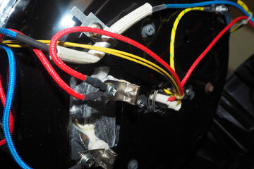 washing machine repair. yellow red blue wires inside the washing machine. service guarantee