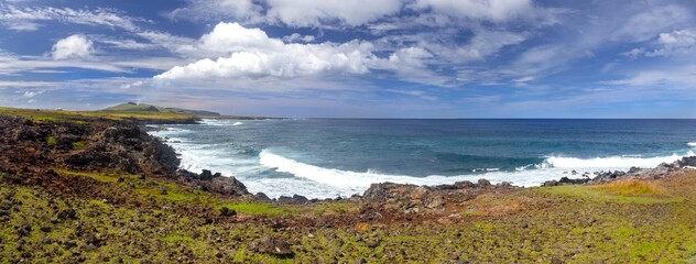 Pacific Ocean Coastline Panoramic View, Easter Island Rapa Nui East Coast.  Distant Poike Volcano Landscape, Blue Skyline Background