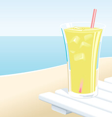 Cold glass of lemonade with ice, at the beach in the Summer.