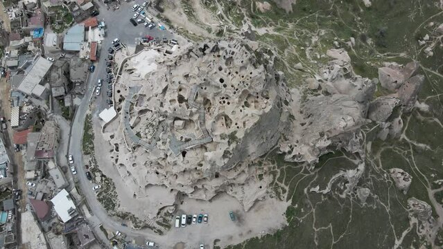 Aerial view of Uchisar Castle in Uchisar old town, carved with caves and numerous tunnels, Cappadocia, Nevsehir, Turkey.
