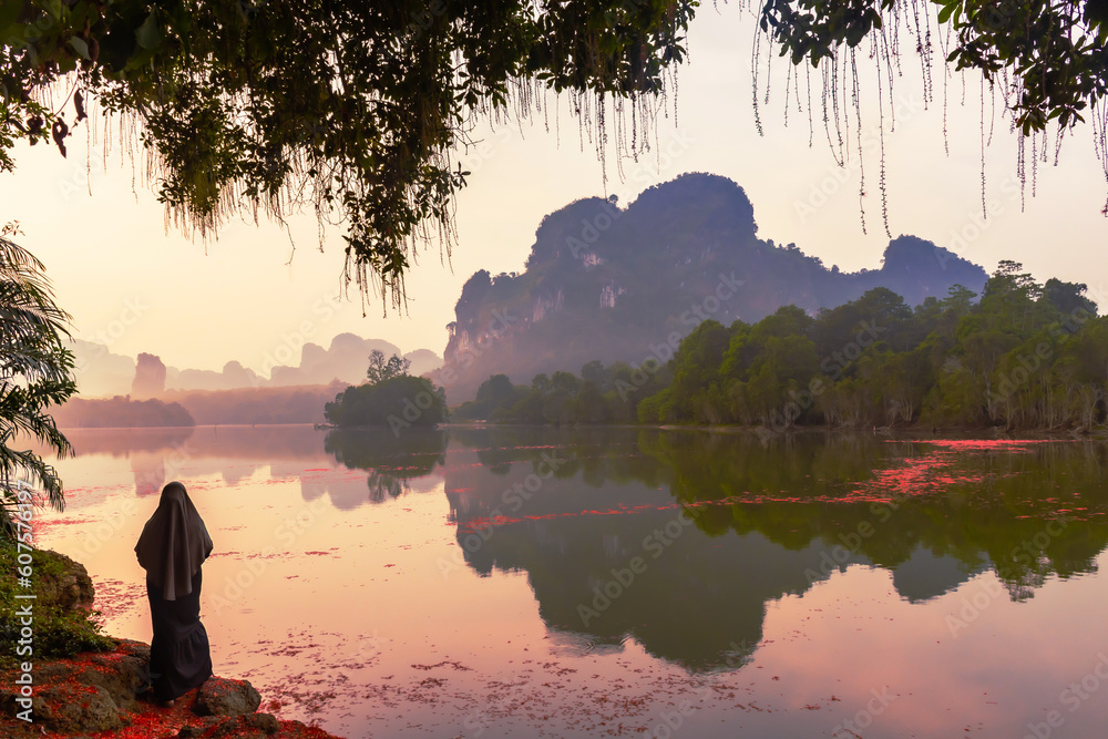 Poster Landscape Nature View of Nong Thale Lake and islamic woman or muslim in Krabi Thailand