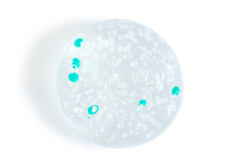 smears and drops of transparent gel with blue granules. On a blank background. PNG