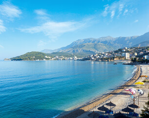 Summer coast morning Himare town view with pebbly beach (Albania)