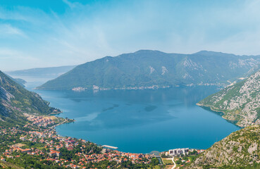 Fototapeta na wymiar Bay of Kotor summer misty view from up and Kotor town on coast (Montenegro). 