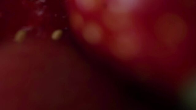 Close-up of the surface, fresh, ripe strawberries. Grains, hairs. Zooming in on a berry